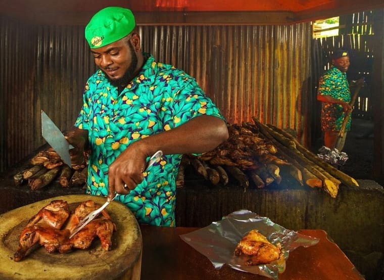 Chicken coming off the jerk pit